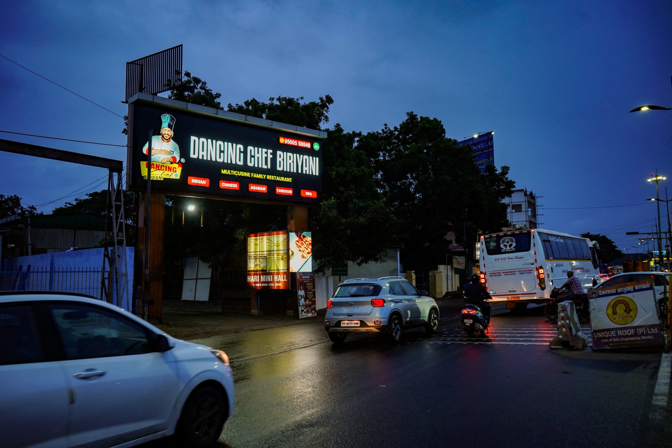 The restaurant and its lit signage at dusk — Dancing Chef Biriyani, Coimbatore (1)
